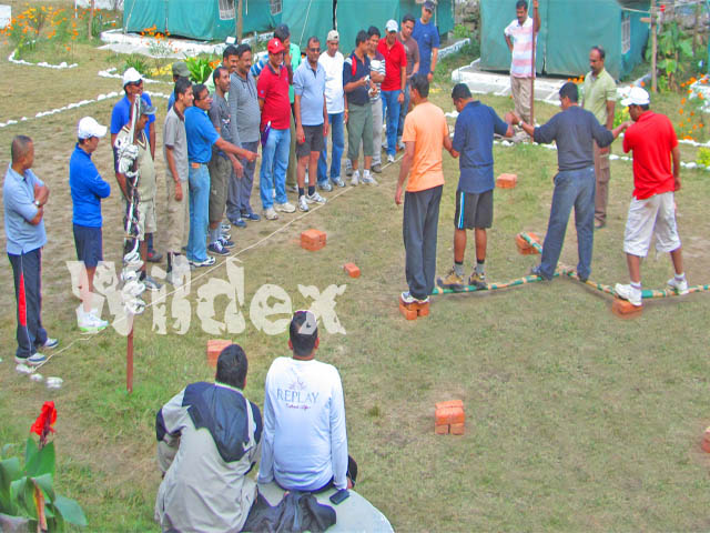 Camps being used for team-building exercise by a corporate group.